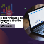 Person using a laptop with the text 'Effective Techniques To Boost Organic Traffic To Your Website' on a modern graphic background featuring upward trends and growth icons.